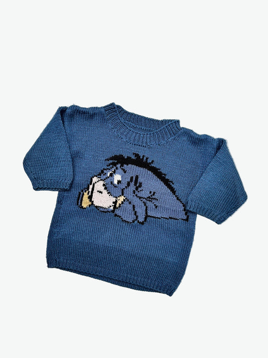 Kids vintage blue knitted jumper with the cartoon character  Eeyore on a light gray background