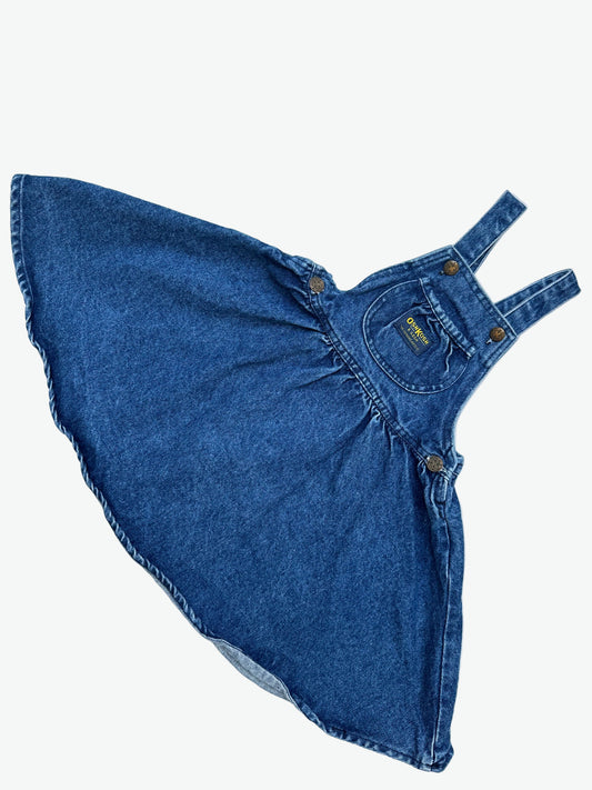 Kids vintage OshKosh dress in a thick and authentic denim fabric with antique brass trims and Oshkosh branding. Very full circle skirt. 