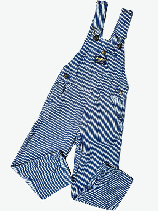 Kids vintage OshKosh dungarees in a blue and white hickory stripe with antique brass trims.  Age 4 years.
