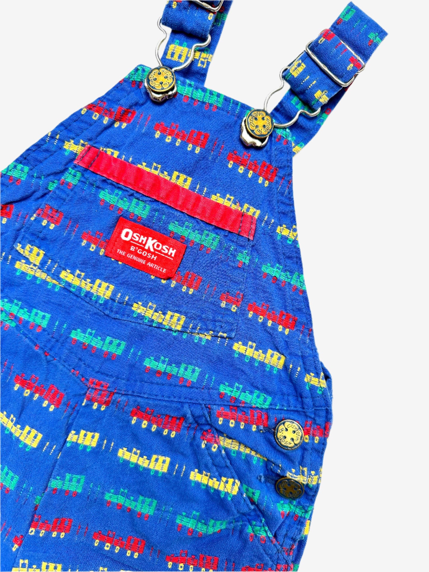 Kids vintage OshKosh short dungarees, with allover multi-colour train embroidery - very special. Age 18 months. Made in USA.