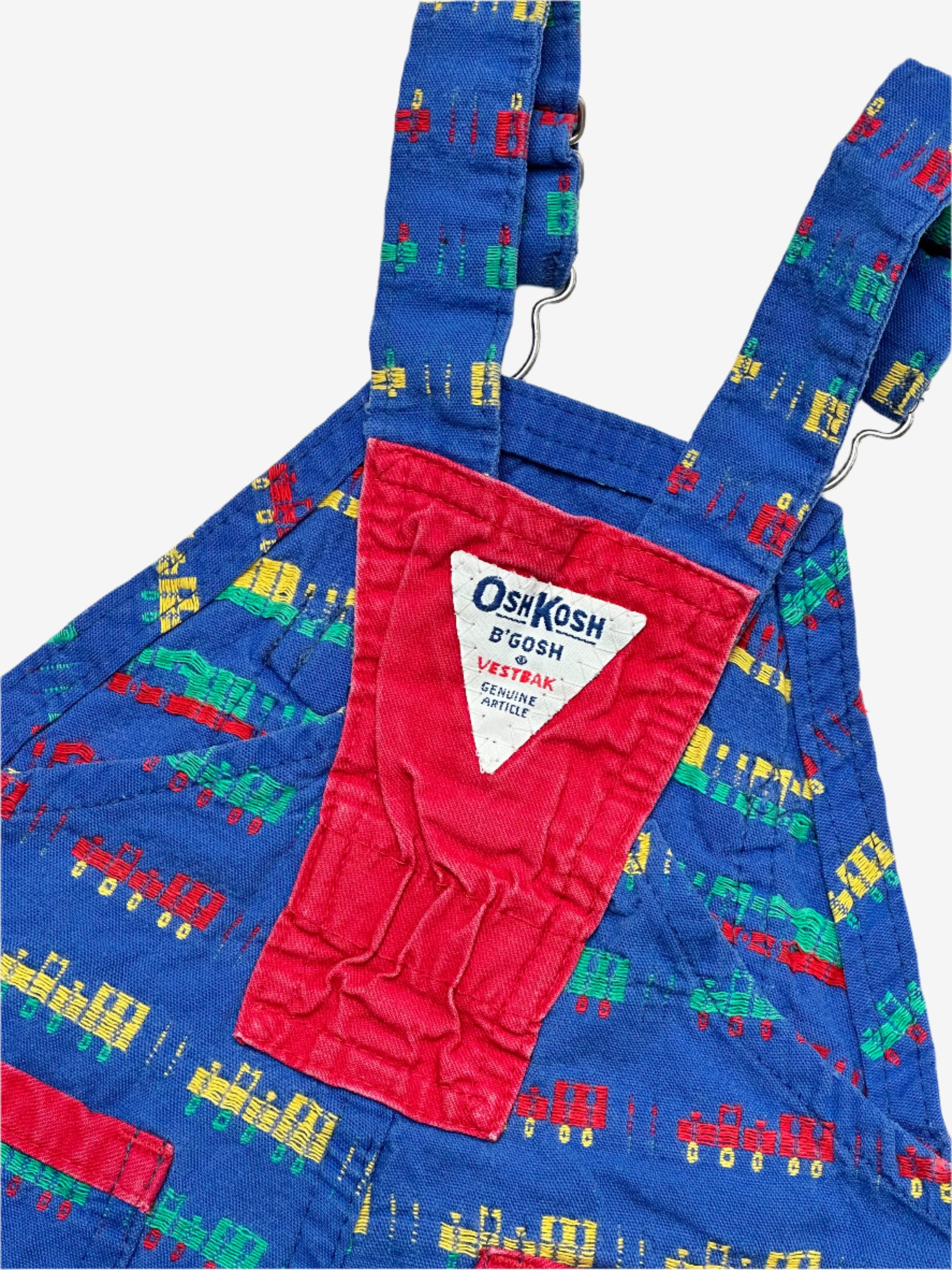 Kids vintage OshKosh short dungarees, with allover multi-colour train embroidery - very special. Age 18 months. Made in USA.