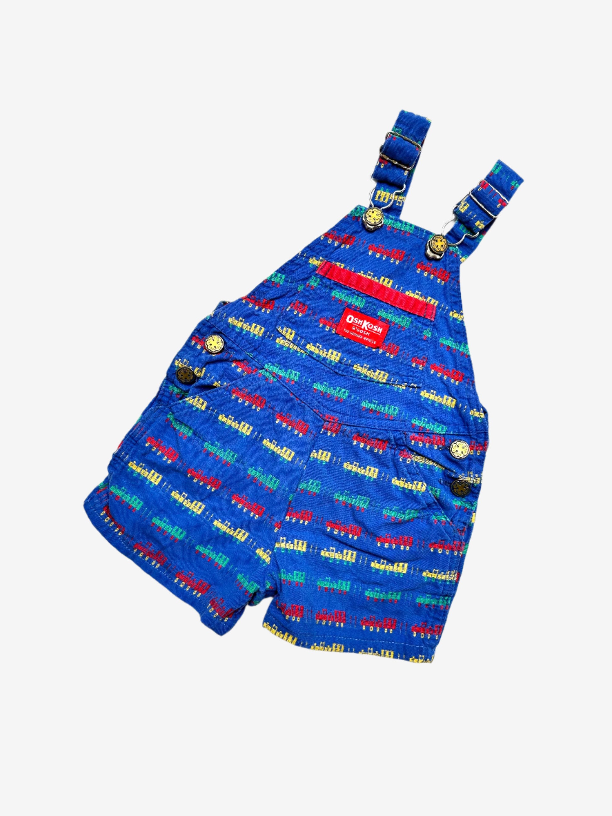 Kids vintage OshKosh short dungarees, with allover multi-colour train embroidery - very special. Age 18 months. Made in USA.