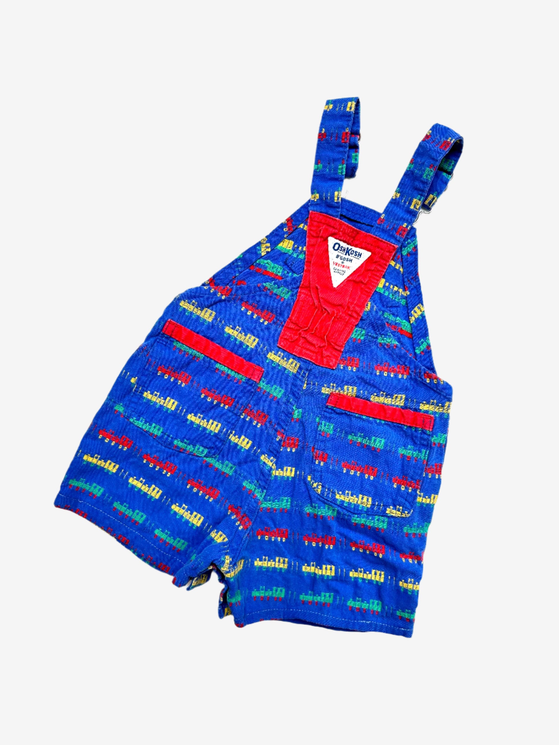 Kids vintage OshKosh short dungarees, with allover multi-colour train embroidery - very special. Age 18 months. Made in USA.