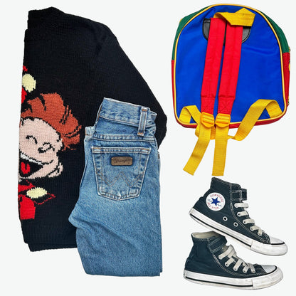 Kids vintage outfit - Black sweater with cartoon character, blue Wrangler jeans, black converse trainers, and colourful backpack on a white background