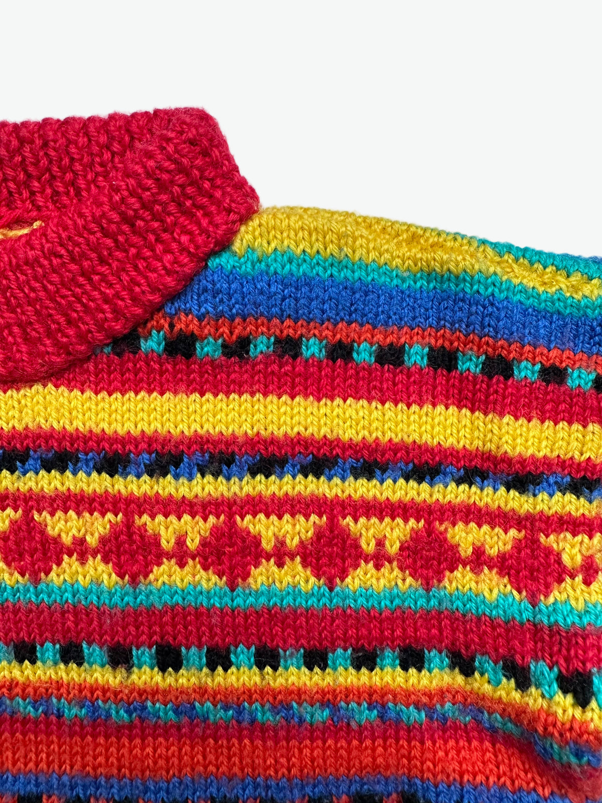 Kids vintage colourful hand knitted jumper with geometric pattern and little figures on a white background
