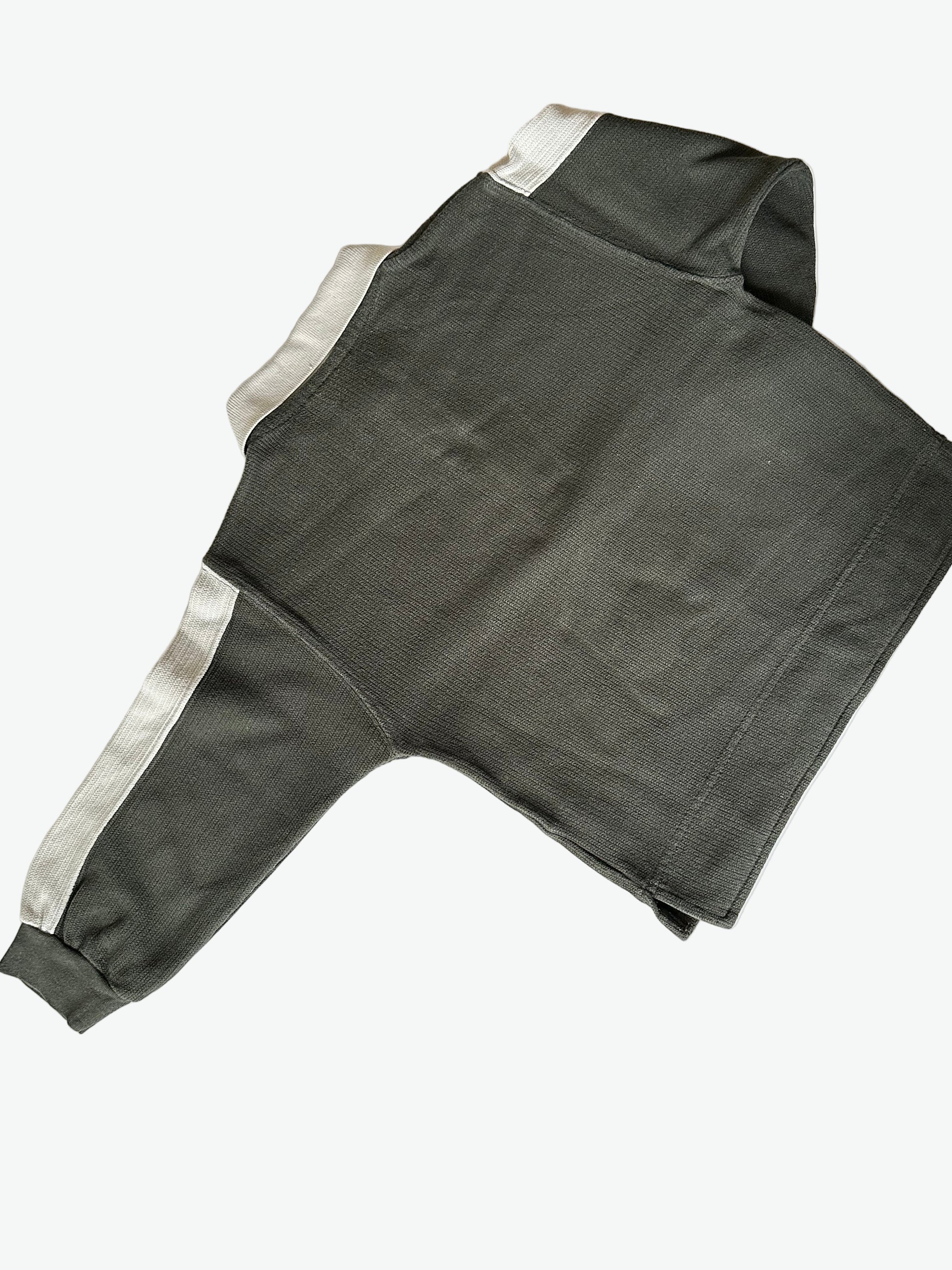 Kid vintage khaki green long sleeve polo shirt with white accents and a bear graphic on a white background