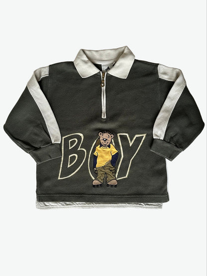 Kid vintage khaki green long sleeve polo shirt with white accents and a bear graphic on a white background.