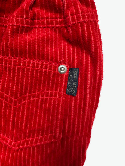 Red corduroy trousers on a white background