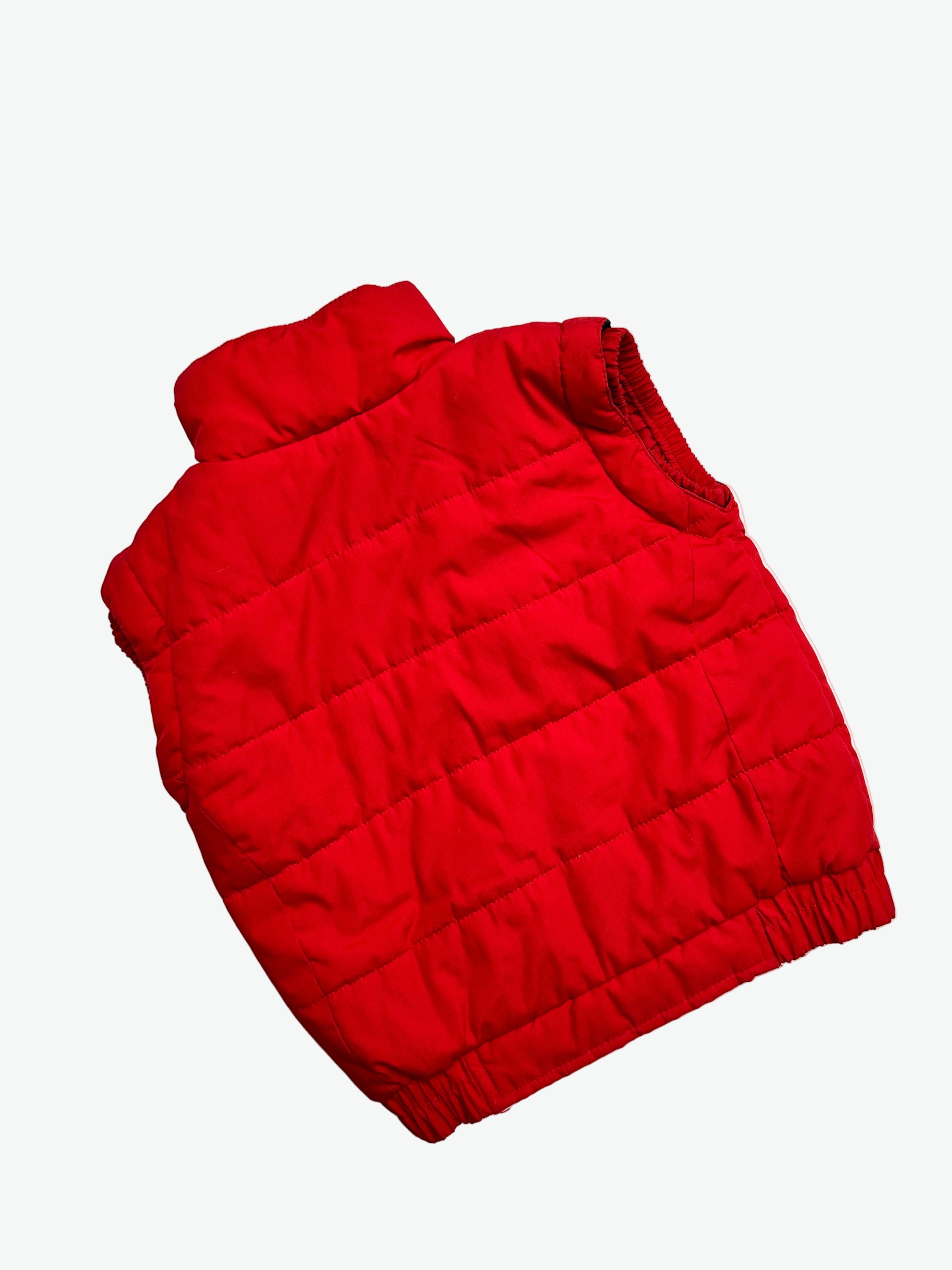 Kids vintage red puffer jacket on a white background.