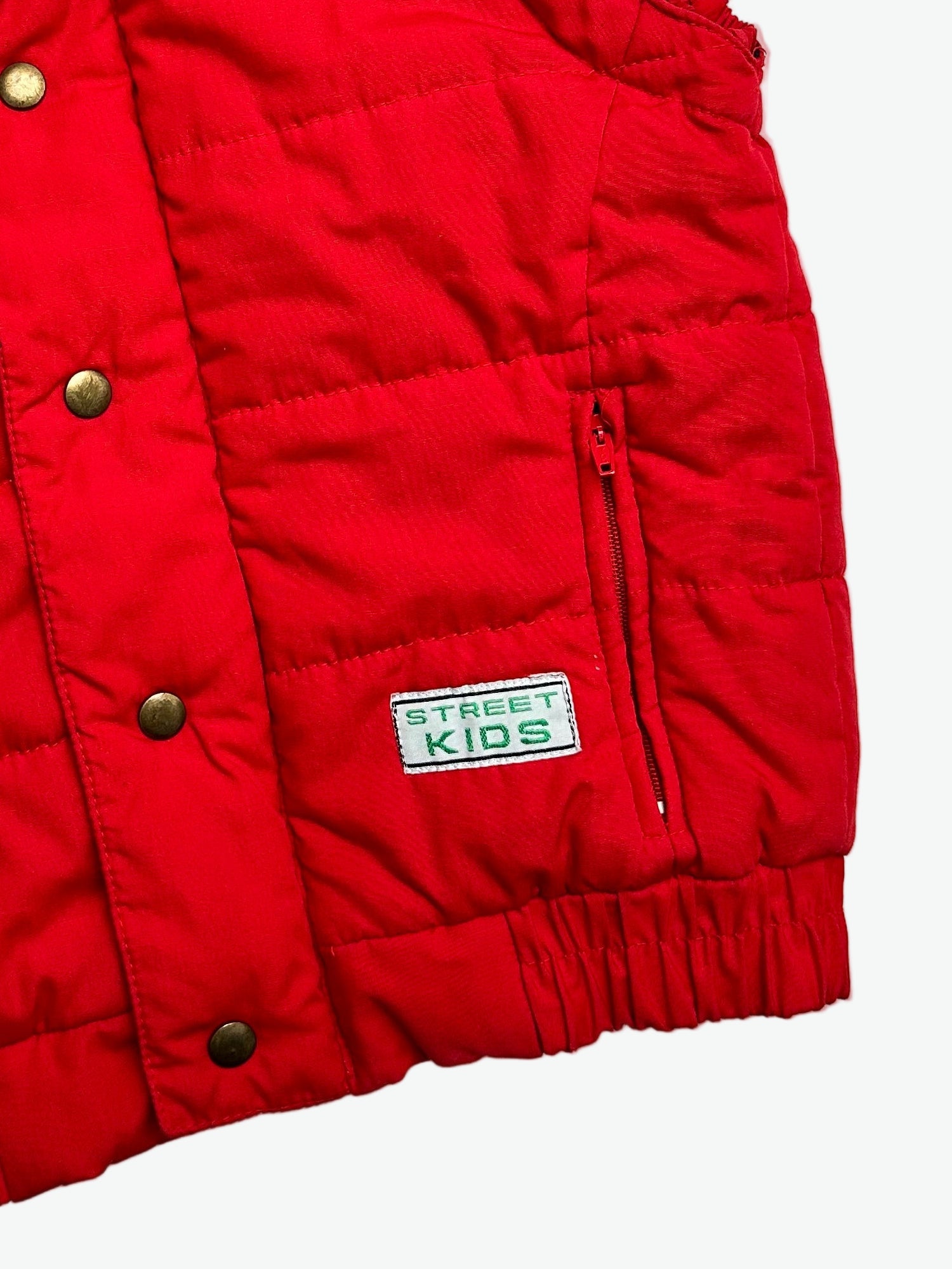 Kids vintage red puffer vest with 'Street Kids' badge on a white background