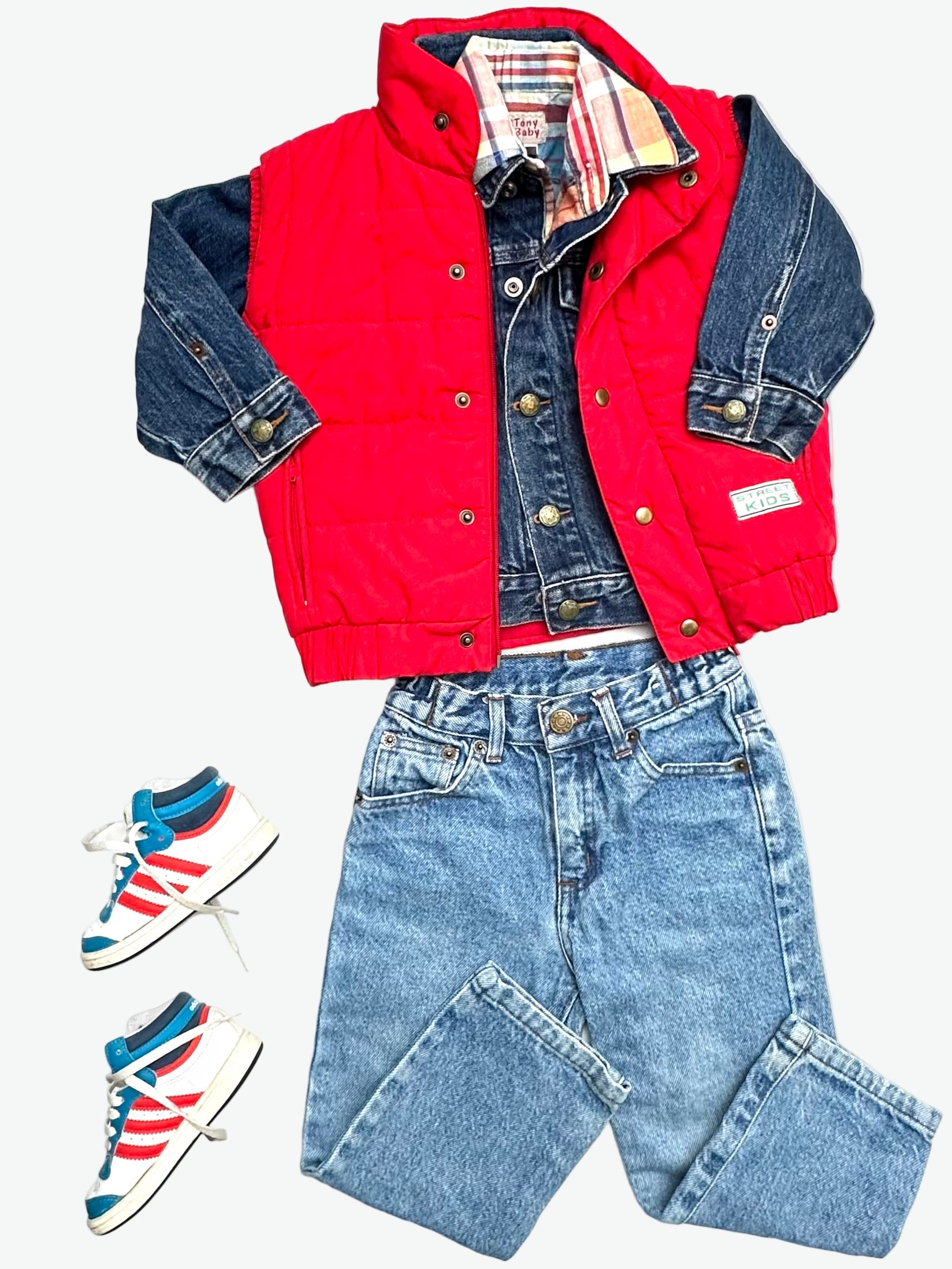 Kids vintage red puffer vest with 'Street Kids' badge on a white background