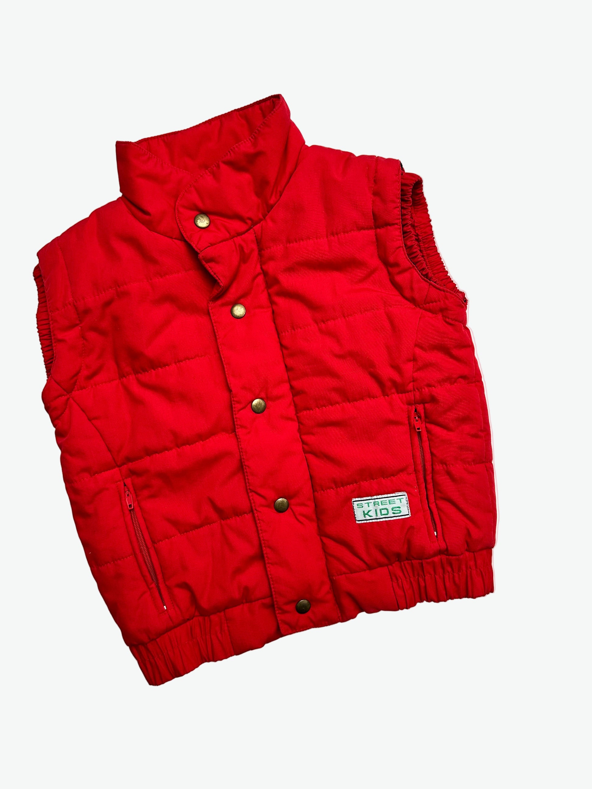 Kids vintage red puffer jacket on a white background.