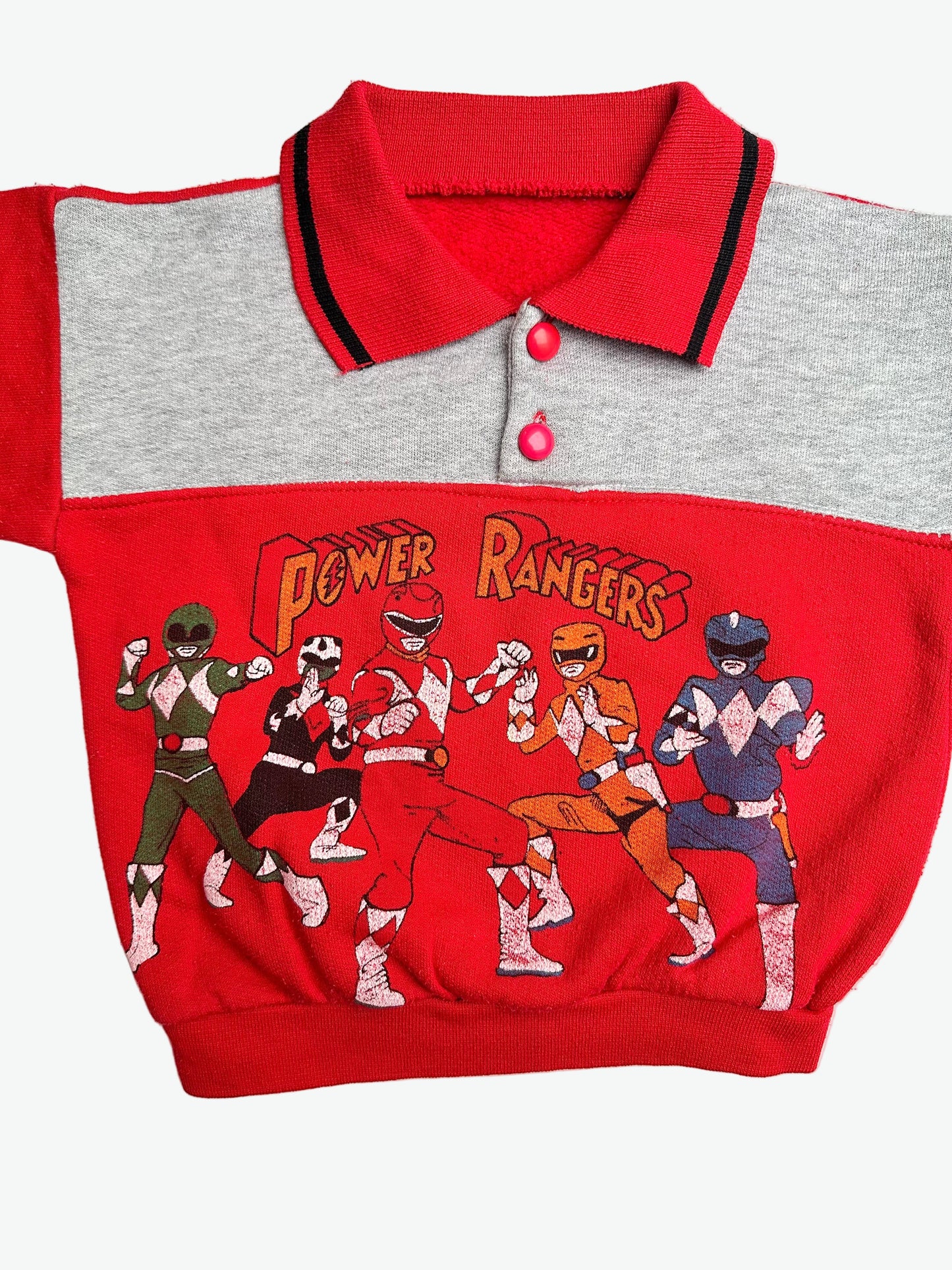 Red and grey collared jumper with the power rangers on the front on a white background