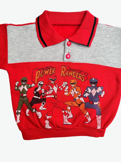 Red and grey collared jumper with the power rangers on the front on a white background