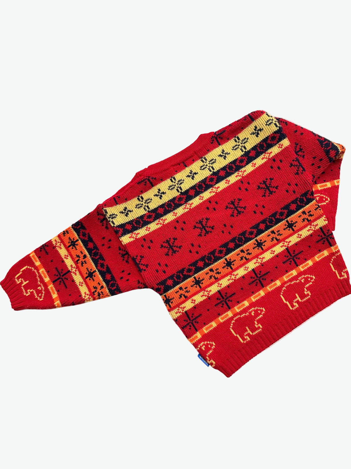 Kids vintage red sweater with snowflake and polar bear pattern on a white background