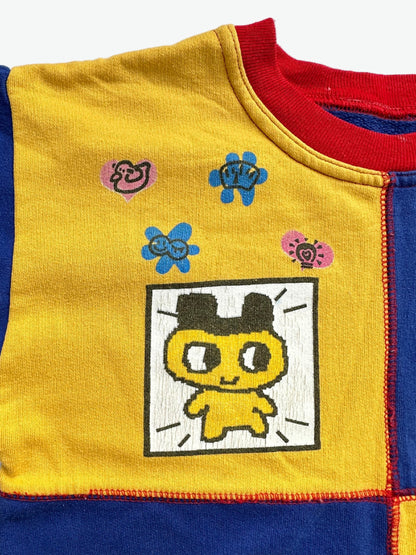 Kids vintage jumper branded Tamagotchi. Multi colour - red, blue and yellow, printed detail from 1996-1997. Age 10 years. 