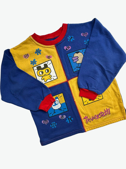 Kids vintage jumper branded Tamagotchi. Multi colour - red, blue and yellow, printed detail from 1996-1997. Age 10 years. 