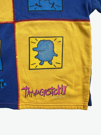 Kids vintage jumper branded Tamagotchi. Multi colour - red, blue and yellow, printed detail from 1996-1997. Age 10 years. 