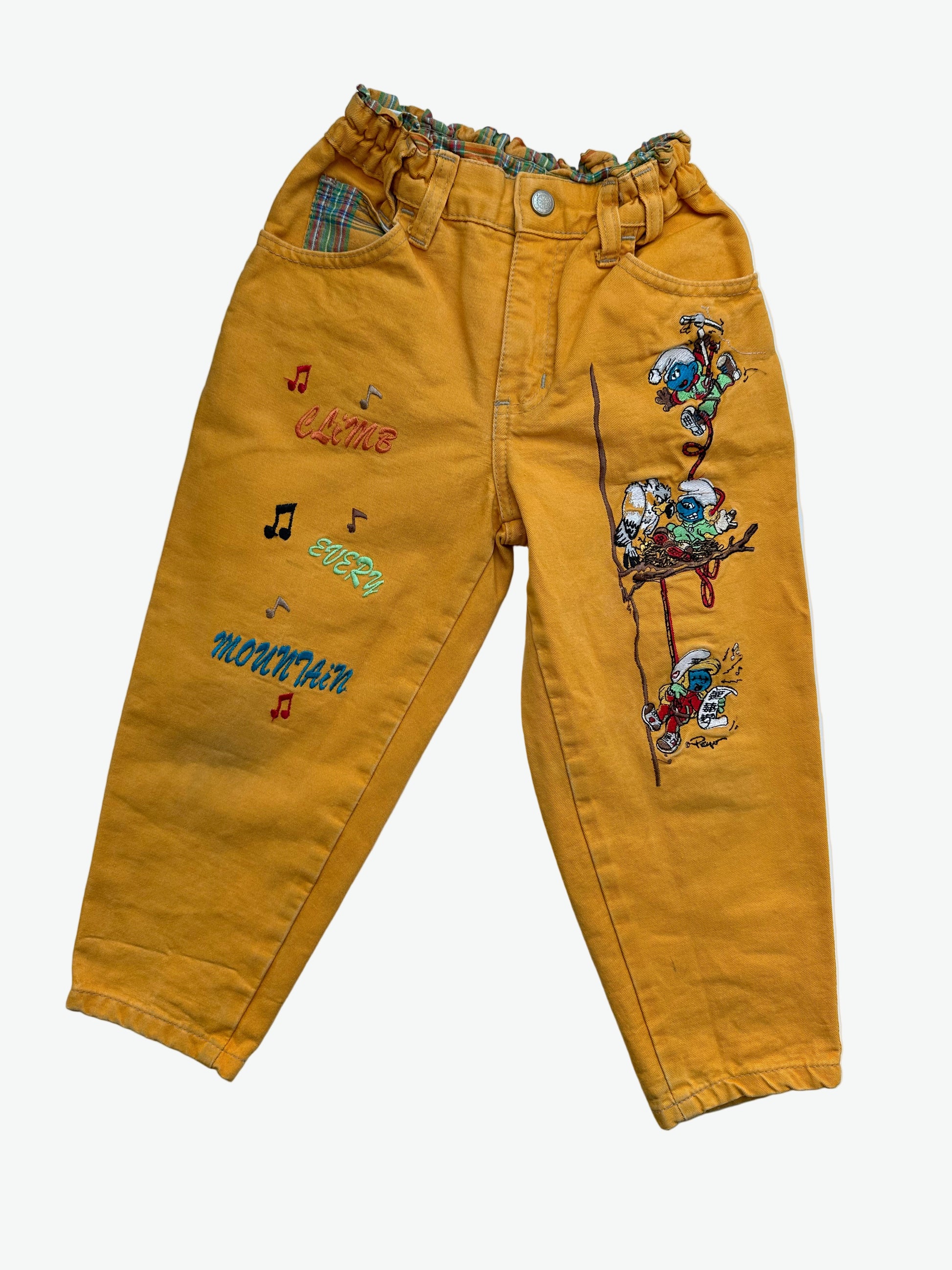Kids vintage yellow trousers with Smurf badge detail on back pocket and embroidery on the front. Tapered shape. Age 3-4 years/ 104cm. 
