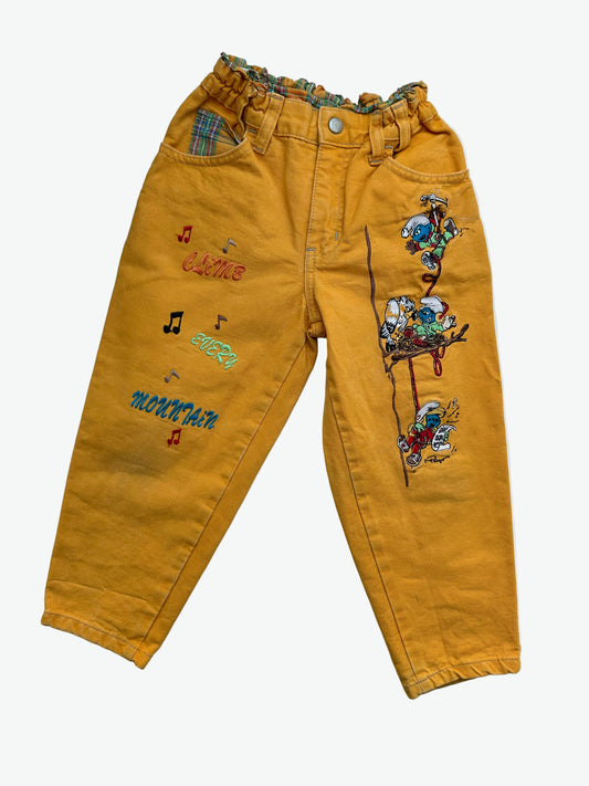 Kids vintage yellow trousers with Smurf badge detail on back pocket and embroidery on the front. Tapered shape. Age 3-4 years/ 104cm. 