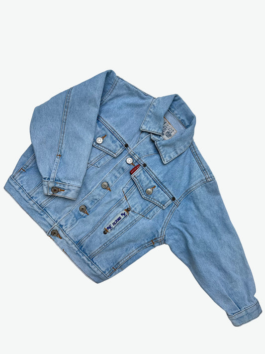 Kids vintage authentic light wash denim trucker jacket with badge details.
