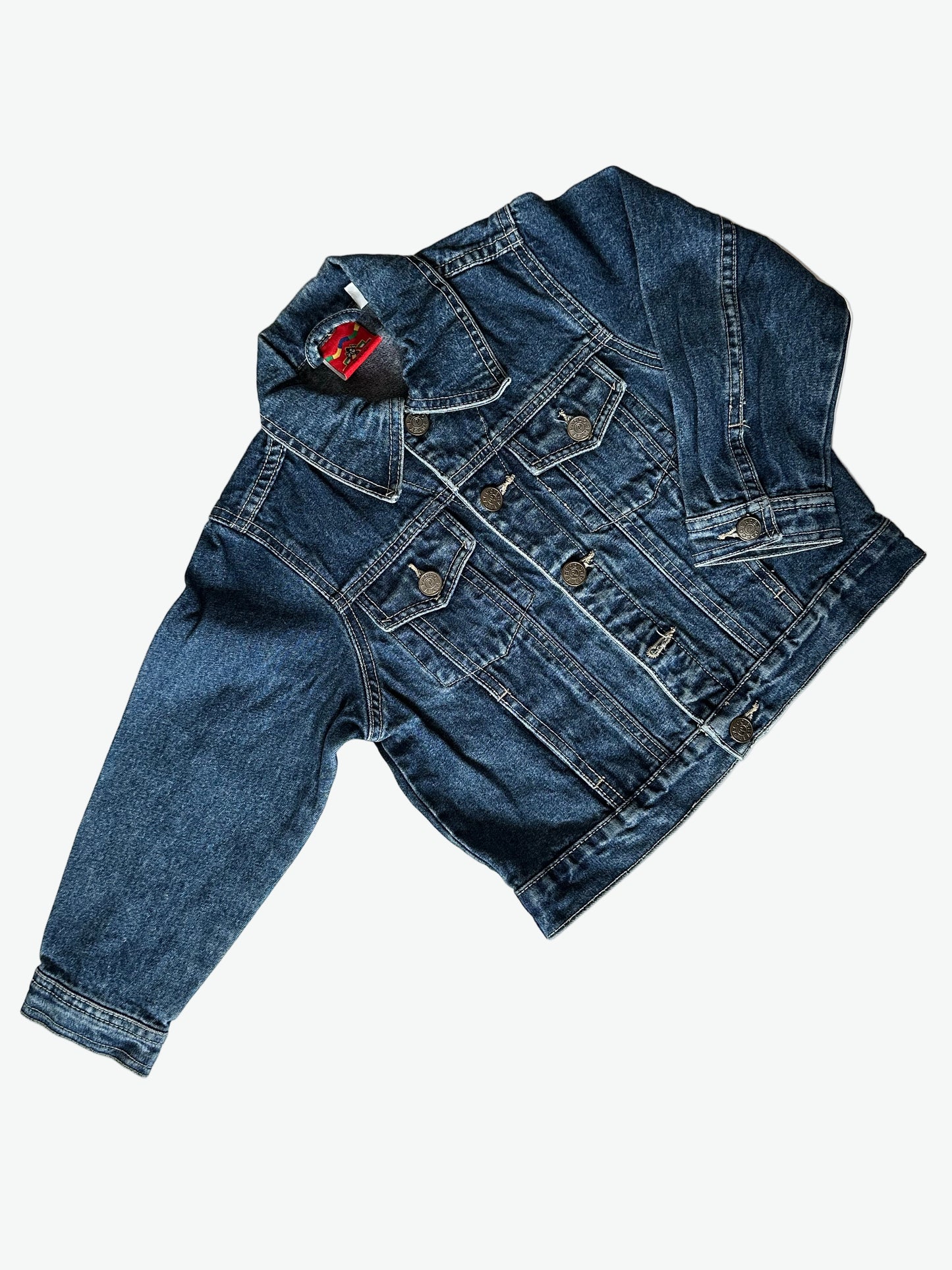Kids vintage dark blue denim jacket with Mickey mouse on a skateboard embroidered design on the back on a white background